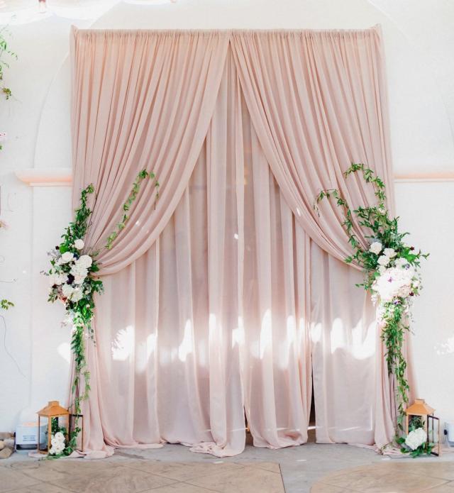 Pink curtain with flowers on it for Jennifer & Lars' Wedding